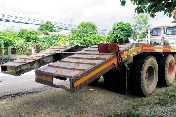 istock Backhoe carry trailer truck 1282298671