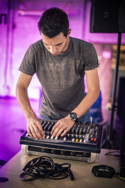 istock Behind the scene. Sound technician electric engineer adjusting sound elements 1282298732