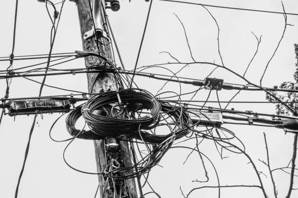 Mess of Telephone Wires on Pole