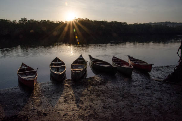 istock Canoes on River at Sunrise 1282300099