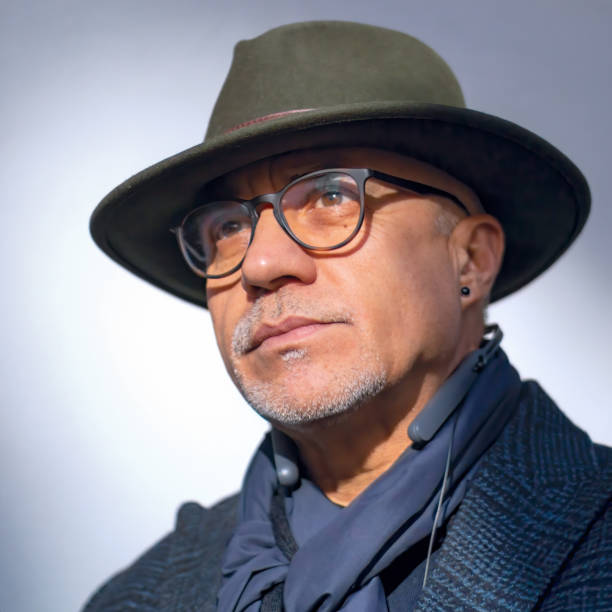 istock middle-aged man with glasses and a fedora hat 1282300212