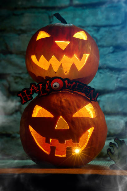 istock Halloween pumpkin with a carved face; Spooky Haloween concept 1282301723