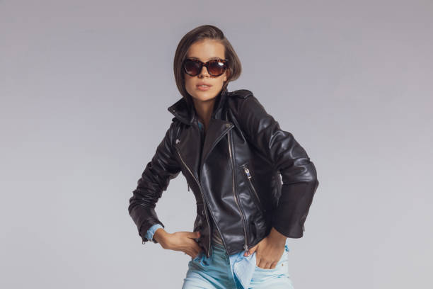 istock Determined fashion model holding hands in pockets while wearing jacket 1282303289