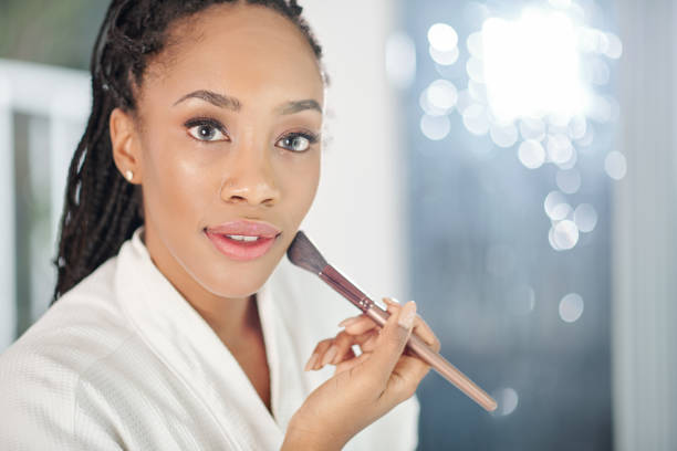 istock Woman applying face powder 1282304306