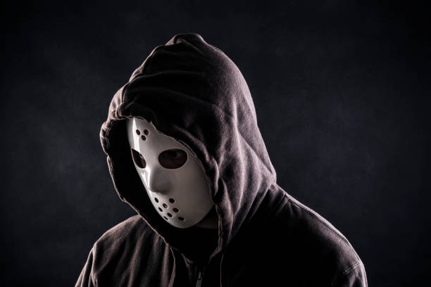 istock Hooded maniac or criminal in mask 1282305922