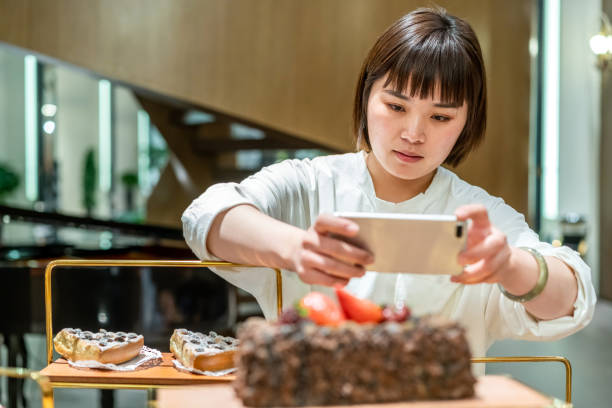 istock Young Asian female baker is working in the bakery 1282309137