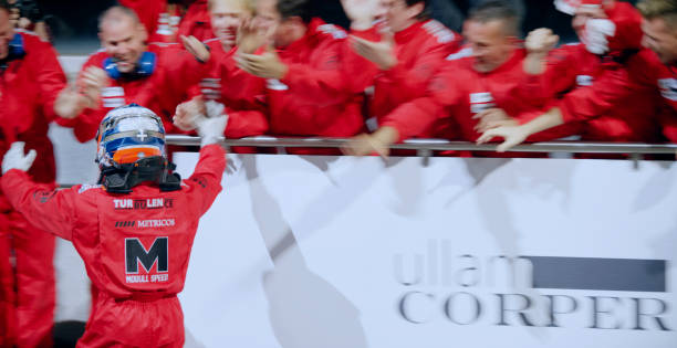 istock Racing team celebrating victory 1282313642