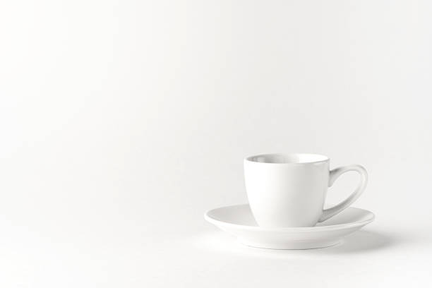 white coffee cup and saucer on a white background. minimalistic design - front view cup saucer white imagens e fotografias de stock