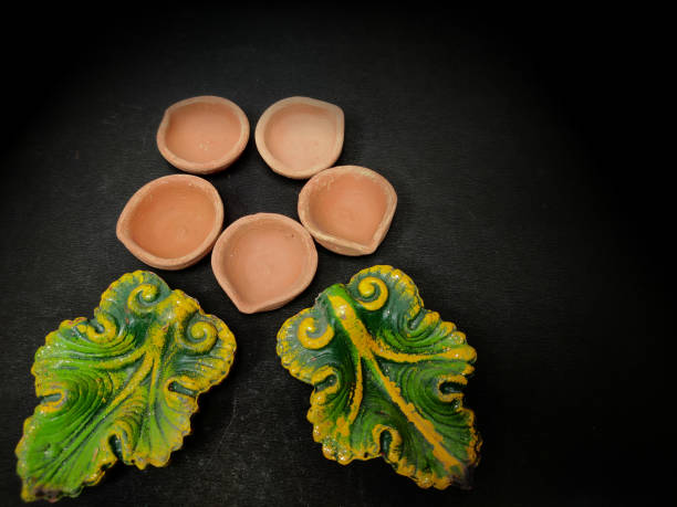 istock Designer Mud clay diya arranged on black background 1282316205