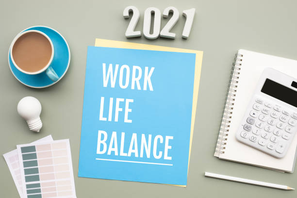 istock 2021 work life balance concepts with text on desk. 1282318389