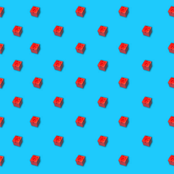 istock Seamless pattern of red gift box with ribbon on a blue surface 1282318405