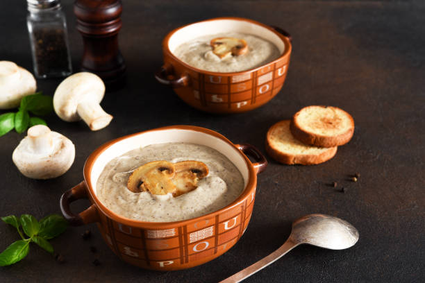 istock Soup puree with mushrooms and cheese on a concrete background. 1282318620