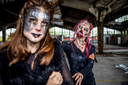 A close-up of a woman in zombie makeup - Zombie portrait - Horror scenes and stage makeup