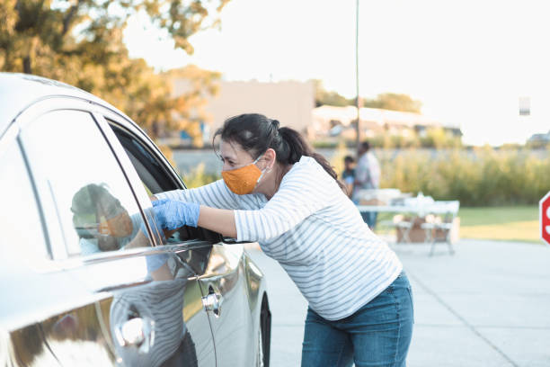 istock Food drive volunteer distributes food 1282319466