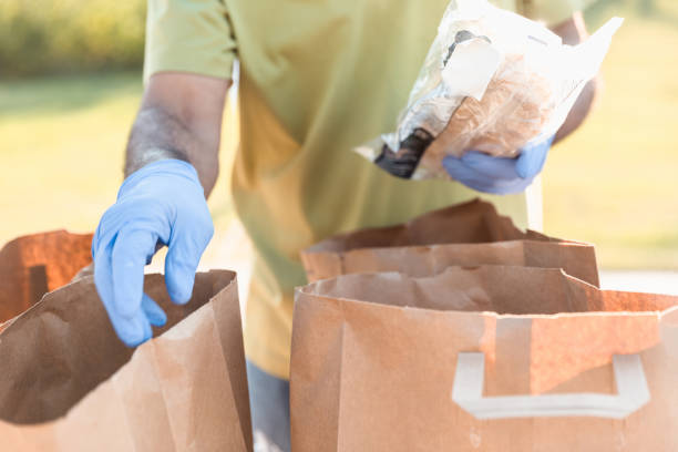 istock Unrecognizable volunteer sorting through food donations 1282319791