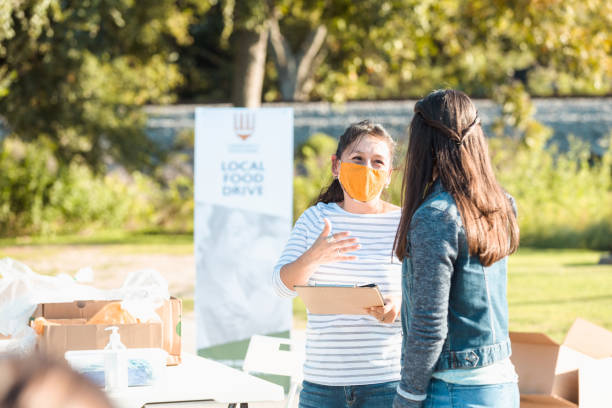 istock Food drive coordinator wears protective mask during COVID-19 1282319881