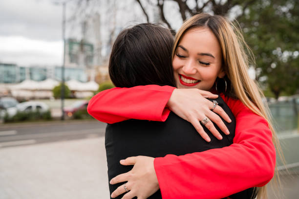 istock Two young friends hugging each other. 1282320370