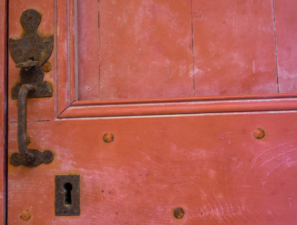 istock Old red door, vintage door handle 1282321599
