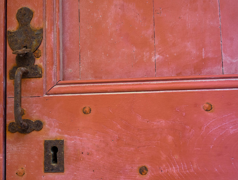 Old red door, vintage door handle, Place for text