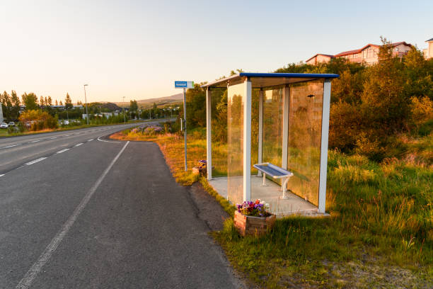 istock Empty bus stop with a glass shelter at sunset 1282321709