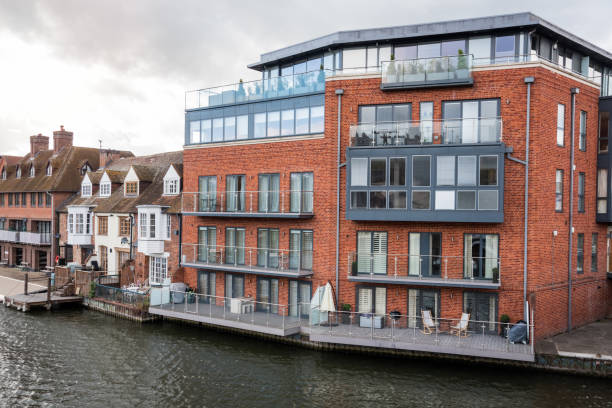 istock Residential buildings along a river on a cloudy spring day 1282321757