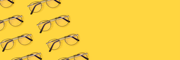 istock Banner with frame made of eyeglasses layout on a yellow background. 1282322753