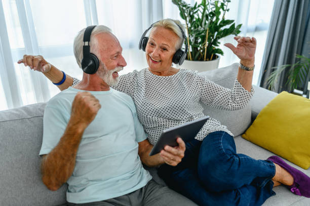 istock Senior couple listening music 1282323105