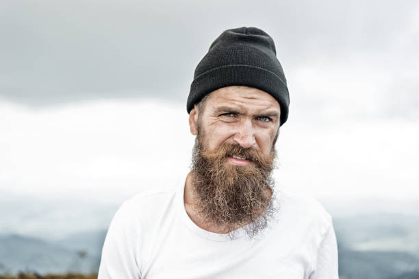 istock Hipster with long beard hair, mustache on bearded face 1282323945