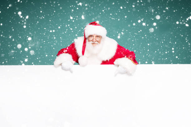 istock Real Santa Claus showing white empty board. 1282324462