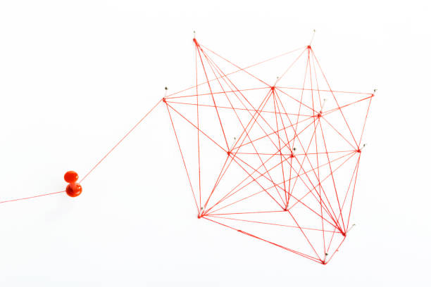 istock A large mesh of pins connected with a cord. Communication, network concept. Red 1282324901