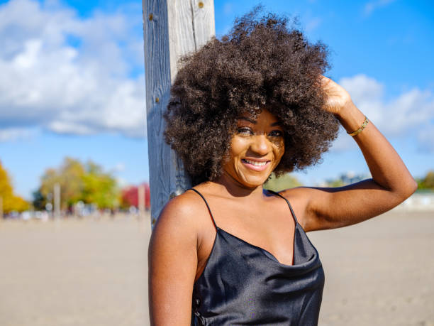 istock African woman on a sandy beach 1282325997