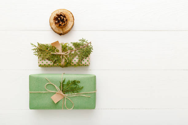 istock Christmas Tree made of Christmas gift, pine cone, tree ring on white wooden table background. Christmas, Xmas, winter, new year concept. Flat lay, frame, top view, copy space. 1282326354