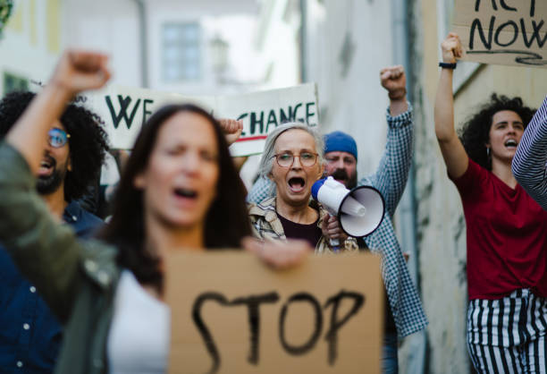 istock Group of people activists protesting on streets, strike and demonstration concept. 1282327704