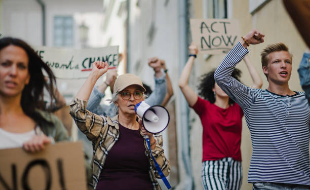 istock Group of people activists protesting on streets, strike and demonstration concept. 1282327773