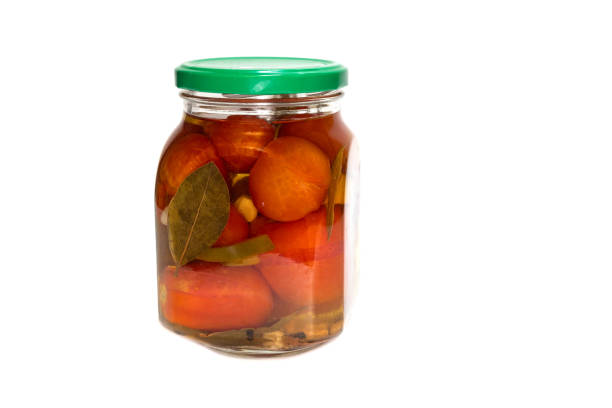 istock pickled tomatoes in glass jar on a white background isolated 1282327794