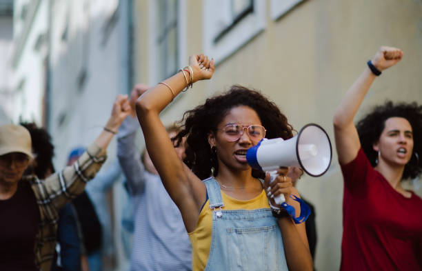 istock Group of people activists protesting on streets, strike and demonstration concept. 1282327893