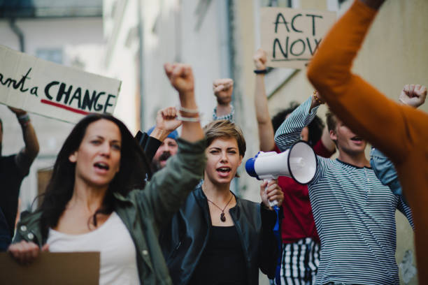 istock Group of people activists protesting on streets, strike and demonstration concept. 1282328062
