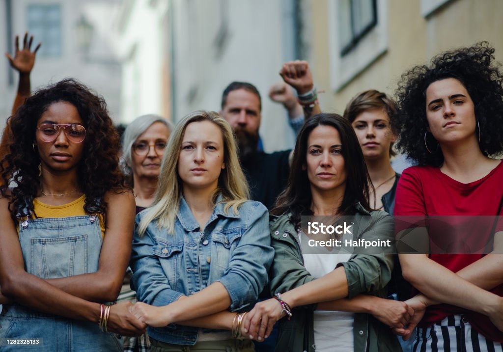 Group of people activists protesting on streets, women march and demonstration concept. Portrait of group of people activists protesting on streets, women march and demonstration concept. Women Stock Photo