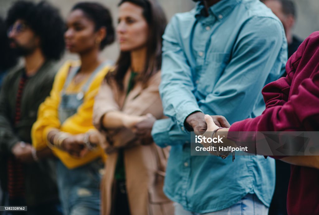 Group of people activists protesting on streets, women march and demonstration concept. Portrait of group of people activists protesting on streets, women march and demonstration concept. Community Stock Photo