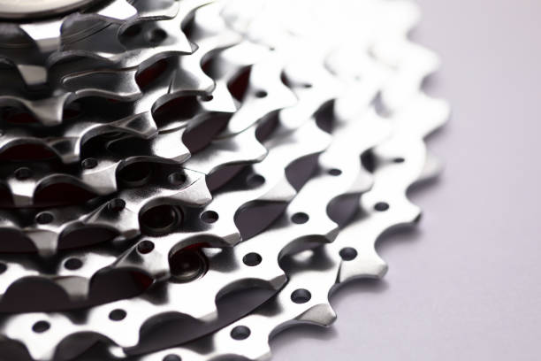 istock Close up of gears isolated on grey background 1282328242