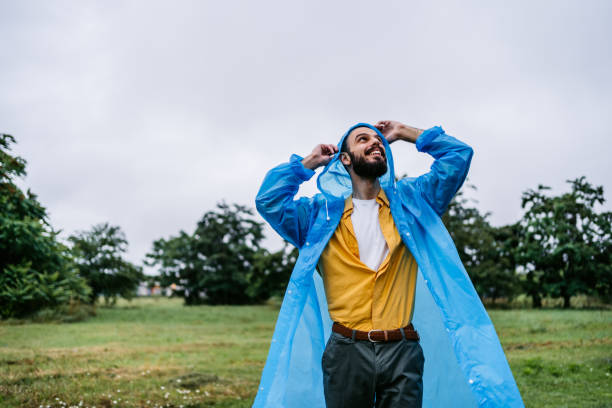istock Man enjoying in the rain 1282328322