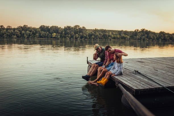 chill time for this three guys - sporting fisherman fishing recreational pursuit imagens e fotografias de stock