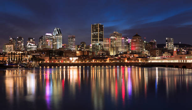 istock Montreal skyline illuminated at night with nice reflections in Saint Lawrence River, Quebec 1282329659