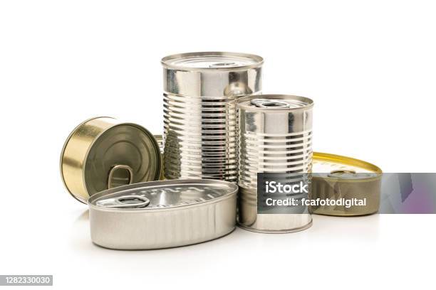 Different Tins Of Food Isolated On White Background Stock Photo - Download Image Now