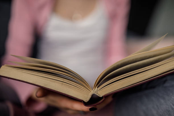 istock Unrecognizable young woman holding a book 1282331132