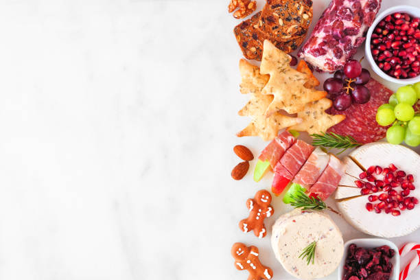 istock Christmas charcuterie side border against a white marble background 1282334016