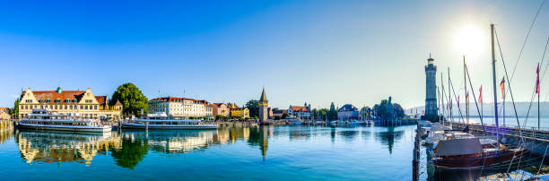famous harbor of Lindau am Bodensee famous harbor with sailboats at the historic island of Lindau am Bodensee - Germany lindau lighthouse stock pictures, royalty-free photos & images