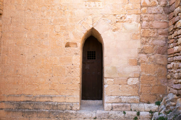 istock Old wood door from a medieval town in Spain. 1282336249