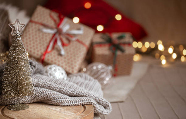 istock Christmas background with a small decorative Christmas tree in the foreground. Festive comfort concept. 1282337312