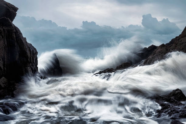 istock Big wave hitting the rocks on coastline in storm 1282337680